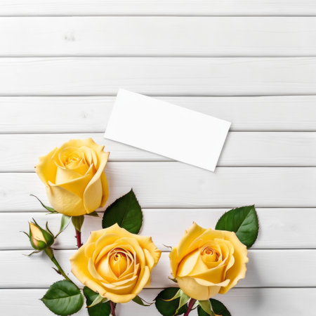 Three Yellow rose flowers over white wood background. Romantic greeting card for Valentine's Day.の素材