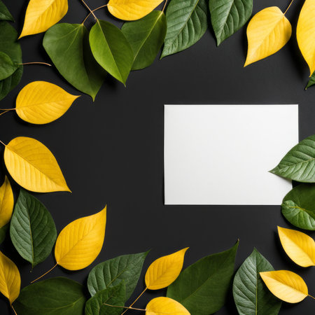 Creative layout made of green leaves and white card on black background. Flat lay, top view. Nature concept.の素材