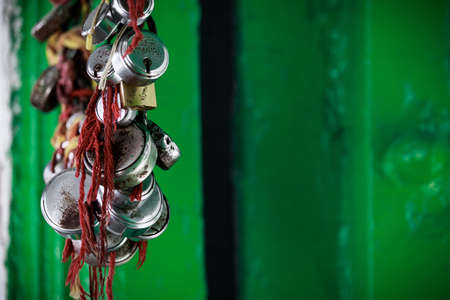 Padlocks hanging on the door of the house. The concept of protection of private property.の写真素材