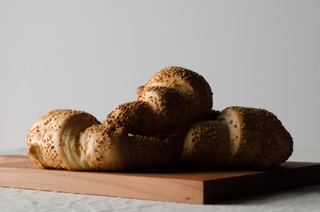 Fresh croissants on a white linen tablecloth.の写真素材
