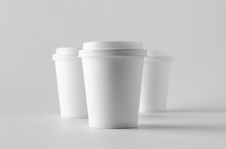 8 oz. white coffee paper cup mock-up with lid.の写真素材