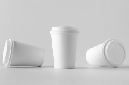 12 oz. white coffee paper cup mock-up with lid.の写真素材