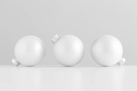 Three white matte christmas balls.の写真素材