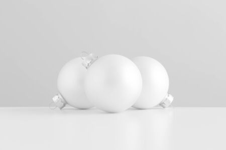 Three white matte christmas balls.の写真素材