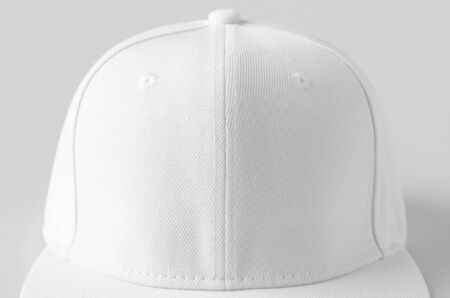 White snapback cap mockup on a grey background, closeup.の写真素材