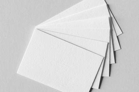 Textured business card mockup on a grey background.  85x55 mm.の写真素材