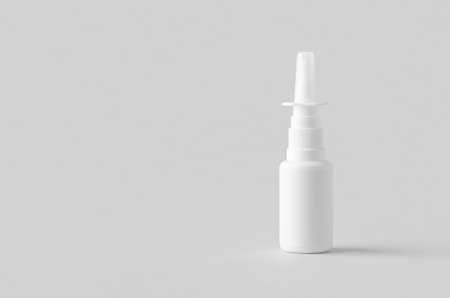 Nasal spray mockup. White plastic bottle with blank label.の写真素材