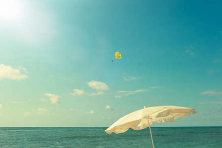 Beach umbrella against the background of the seaの写真素材
