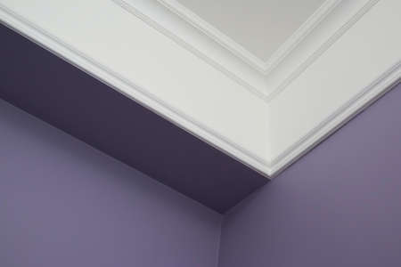 Ceiling moldings in the interior, detail of a angular ceiling skirting.の写真素材