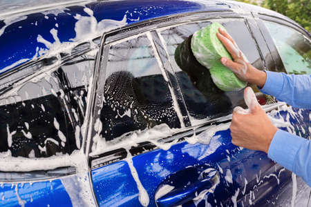 Washing cars on a car wash. Cleaning concept.の写真素材