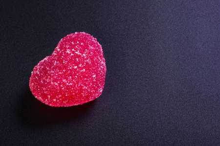 Marmalade in the form of a heart at the dark background with a breaking trace for St. Valentines Day.の写真素材