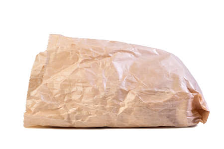 Rumpled paper bag on white isolated background.の写真素材