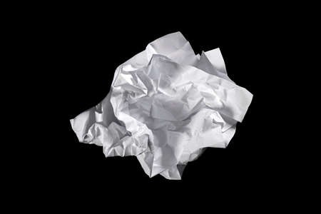 Crumpled paper isolated on a black background.の写真素材