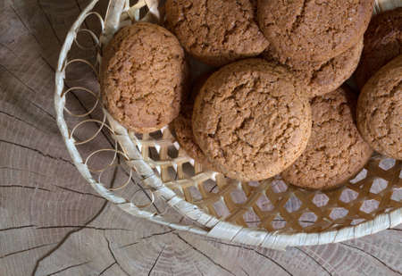 Oatmeal cookies on a wooden table, close-up