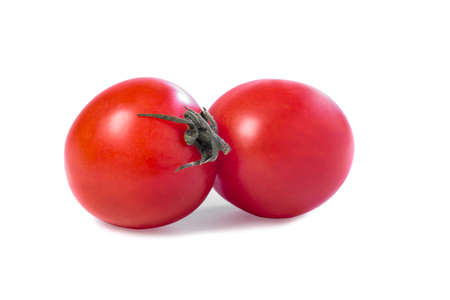 Two fresh chili tomatoes on white background, close-upの写真素材