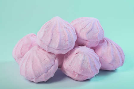 Fresh pink zephyr on a green background. sweetsの写真素材