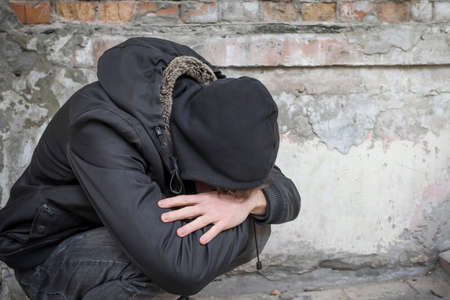 A person is an addict experiencing a drug addiction crisis after prolonged drug use. Addiction concept.の写真素材