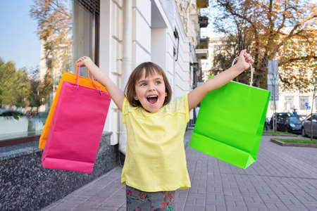 A happy girl with purchases.の写真素材