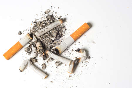 Cigarette burns at the white background.