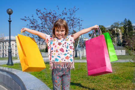 The happy child with color packages.の写真素材