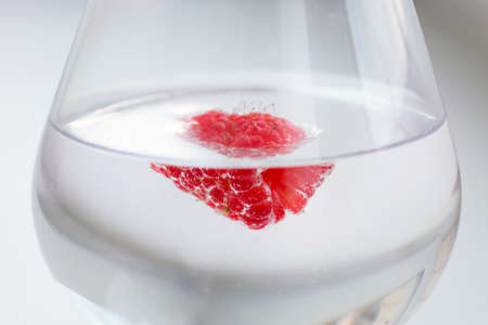Fresh raspberries in a glass. A close-up.の写真素材