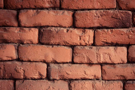 Red brick wall closeup. Old red brick wall texture backgroundの写真素材
