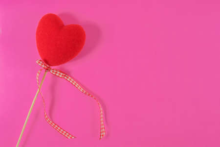 Red heart heart on a pink background. Valentine's Day. Close-up.