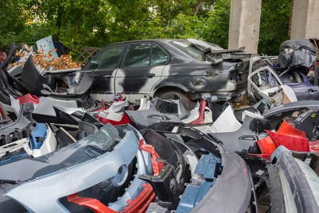 Scrapyard of bumpers. Motor-car dump, cemetery.の写真素材