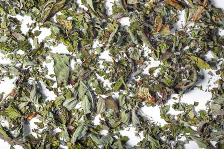 Leaves dry tea on a white background. Close up of tea. Top view.