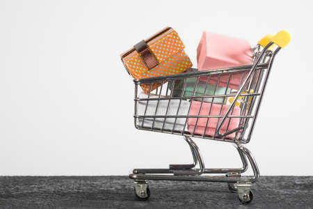 A shopping cart with presents. A close-up, shopping, a supermarket.の写真素材