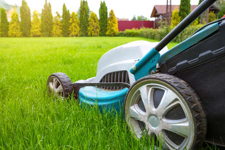 Lawn mowers close-up on a sunny day. Grass care. Gardening concept.