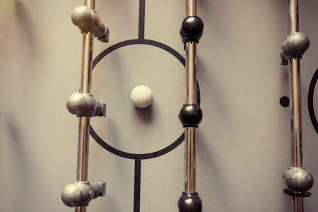 A football table, a close-up. A view from above. A toned photo.