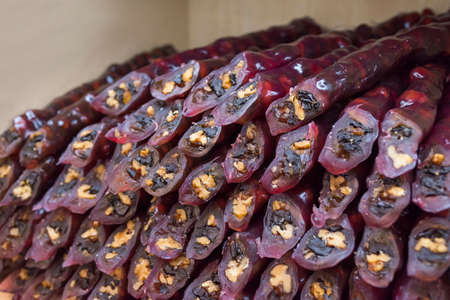 Homemade sweets with hazelnuts, walnuts, grape juice and honey. Close-up