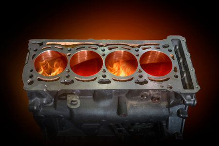 Disassembled engine burning in flames on a dark red background. Repair service.