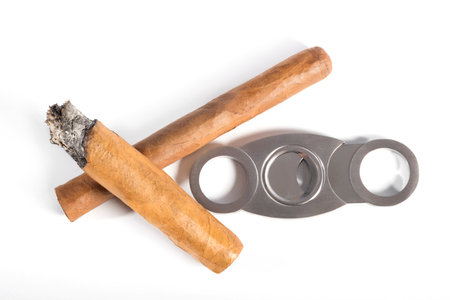 Cigars and accessories on a white background. View from above.の写真素材