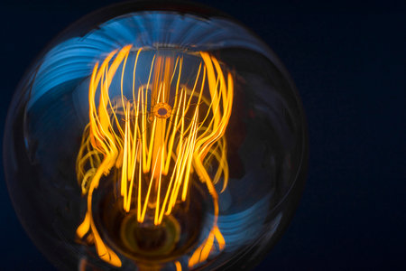 Beautiful large round retro lamp with incandescent threads. Close-up. Creativity concept.