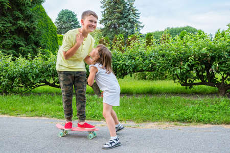Children play outside in the park. Smiling children outdoors.の写真素材