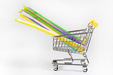 Colored plastic tubes in a cart, a close-up.の写真素材