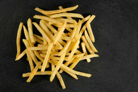 French fries on a dark background. View from above. Fast food.の写真素材