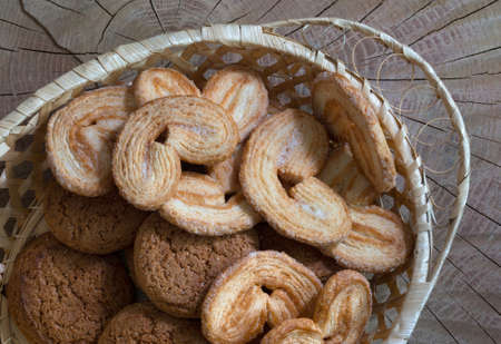 Home-made cookies in a basket, close up. Top view.