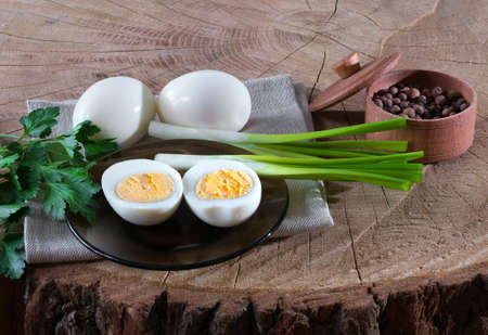 Eggs on a wooden background outdoors.の写真素材