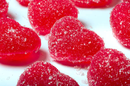 A candy in the form of a heart, a close-up at the white background. on St. Valentine's Day.