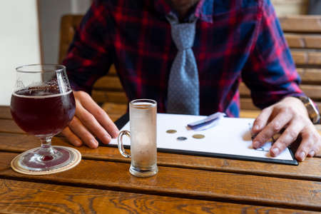 Alcoholism concept. Unemployed man in a bar. Fight against alcohol addiction, drug addiction,...