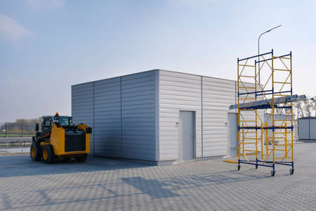 Modern factory warehouses and outdoor equipment. Forklift