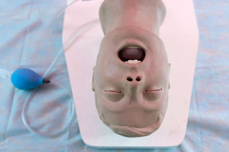The patient a doll on the operating table.