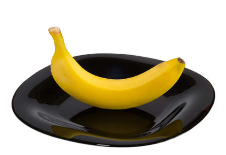 Single banana, in a dish isolated on a white backgroundの写真素材