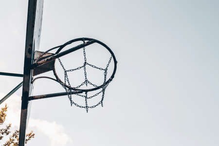 Old metal basketball hoop outdoors. Active lifestyle concept.の写真素材