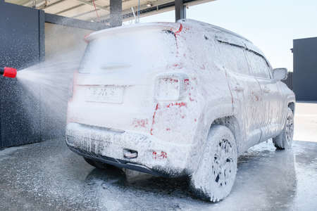 Foam car. Car wash with high pressure foam.の写真素材