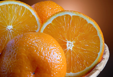 Fresh oranges, tangerines closeup on a red background.の写真素材