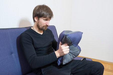 Mental health concept. Man in depression in the doctor's office. Therapy, crisis, social problems.の写真素材